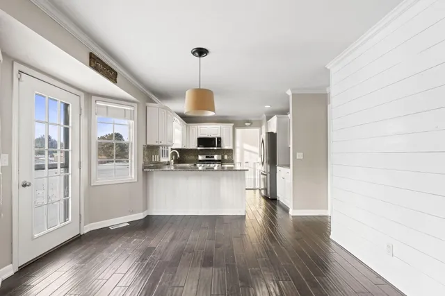 a view of a hallway with staircase