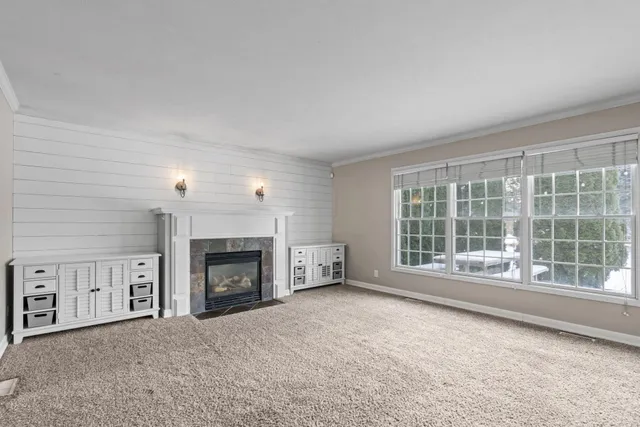 an empty room with a empty space and windows