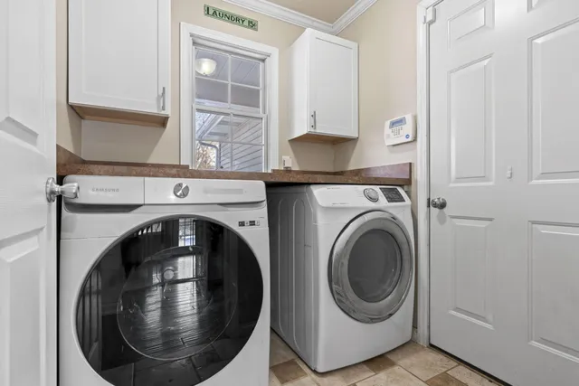 a view of a patio with a table and chairs