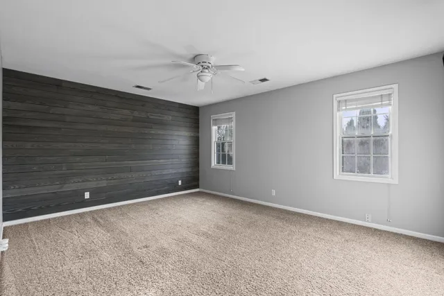 a view of a house with a yard and a street view
