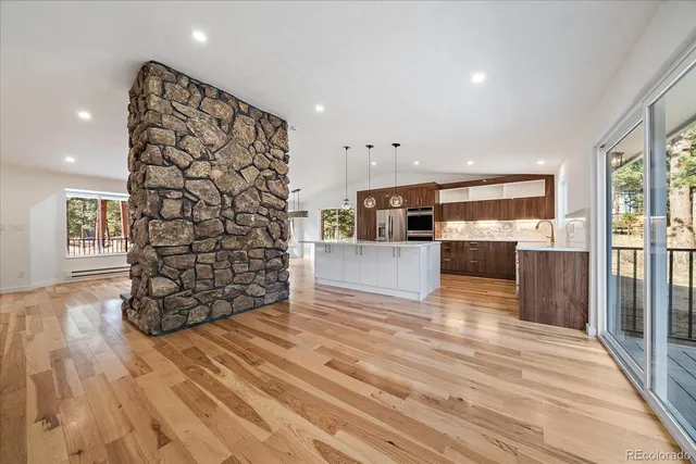 a view of kitchen with furniture and wooden floor