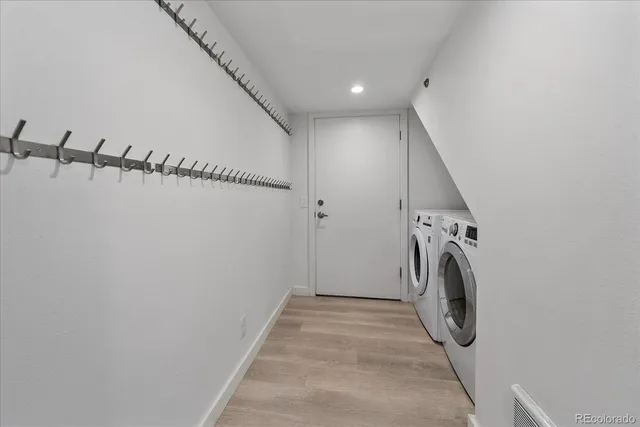 a view of a hallway with washer and dryer