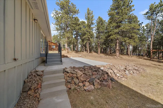 a view of a backyard of the house