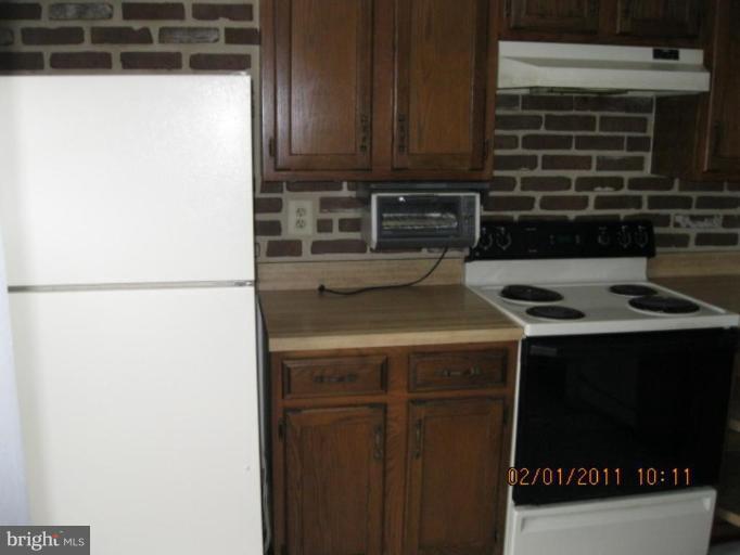 1327 Apple Ridge Court Edgewood, MD 21040 - Photo 15 of 19 a kitchen with a refrigerator and a stove