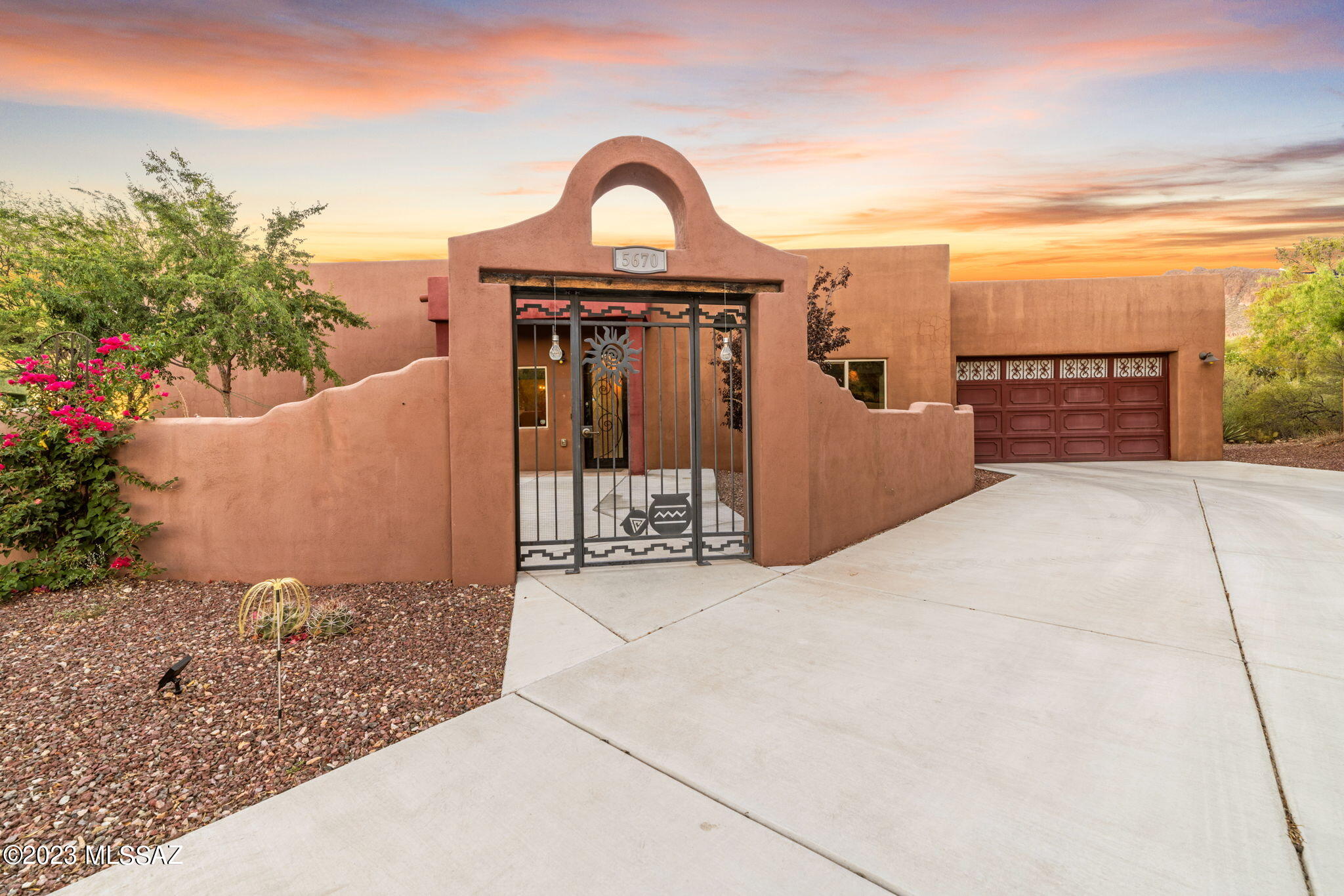 5670 Triangle X Place Tucson, AZ 85713 - Photo 2 of 36 a front view of a house with garden