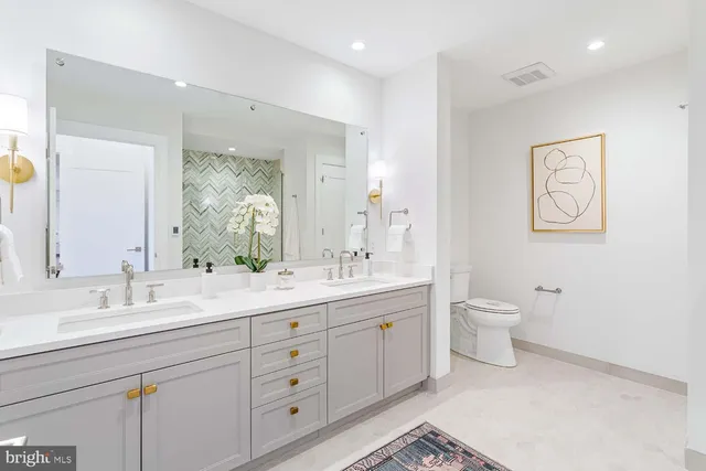 a view of a hallway with wooden floor and closet
