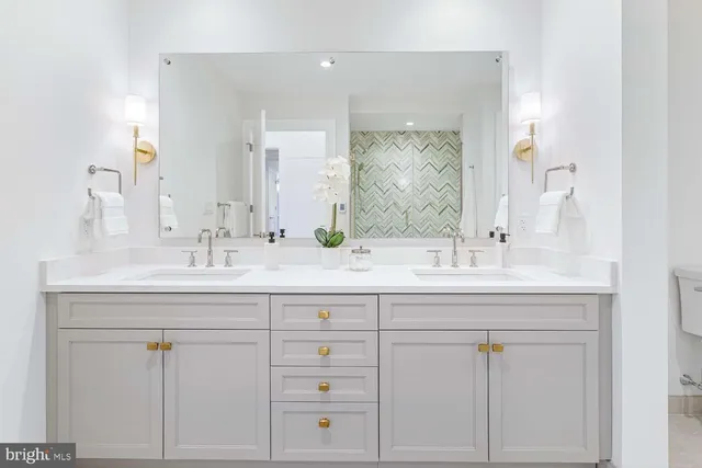a bathroom with a sink a toilet and bathtub