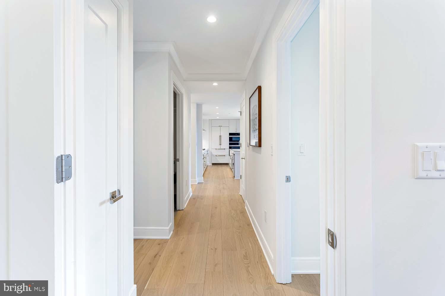 6718 Lowell Avenue, Unit 406 McLean, VA 22101 - Photo 29 of 86 a view of a hallway with wooden floor