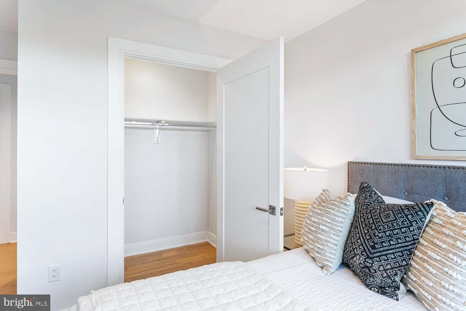 6718 Lowell Avenue, Unit 406 McLean, VA 22101 - Photo 32 of 86 a bedroom with a bed and a window