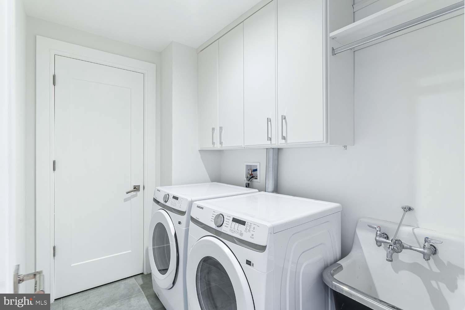 6718 Lowell Avenue, Unit 406 McLean, VA 22101 - Photo 38 of 86 a utility room with dryer and washer