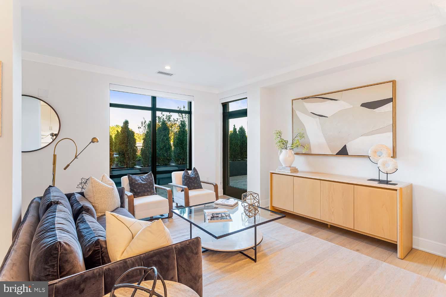 6718 Lowell Avenue, Unit 406 McLean, VA 22101 - Photo 41 of 86 a living room with furniture and a large window