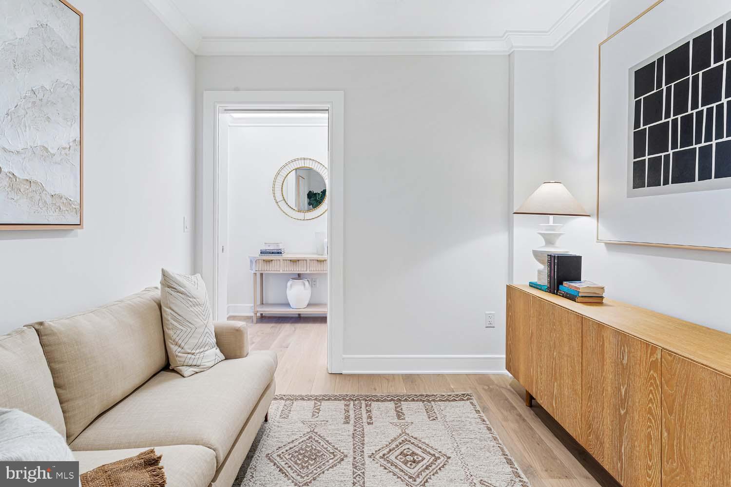 6718 Lowell Avenue, Unit 406 McLean, VA 22101 - Photo 5 of 86 a living room with furniture and a window