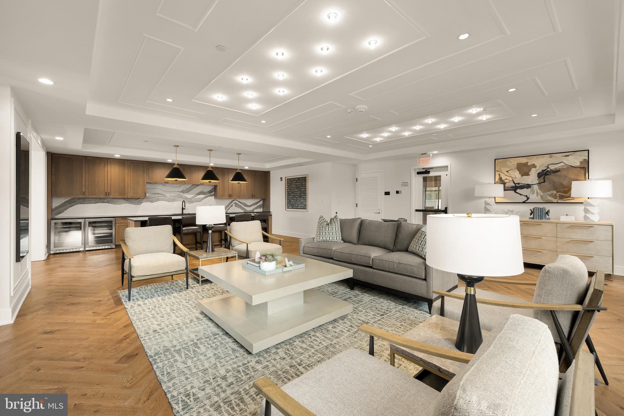 6718 Lowell Avenue, Unit 406 McLean, VA 22101 - Photo 62 of 86 a living room with furniture and a table