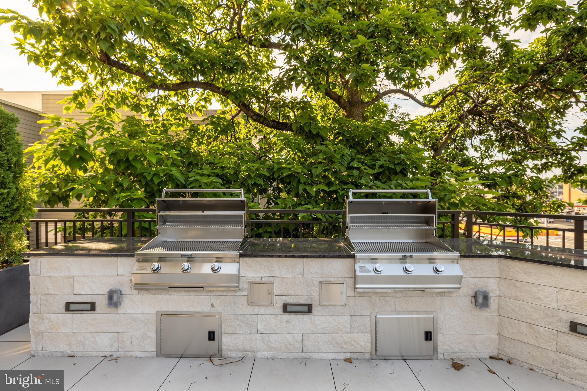 6718 Lowell Avenue, Unit 406 McLean, VA 22101 - Photo 64 of 86 a stove top oven sitting inside of a kitchen