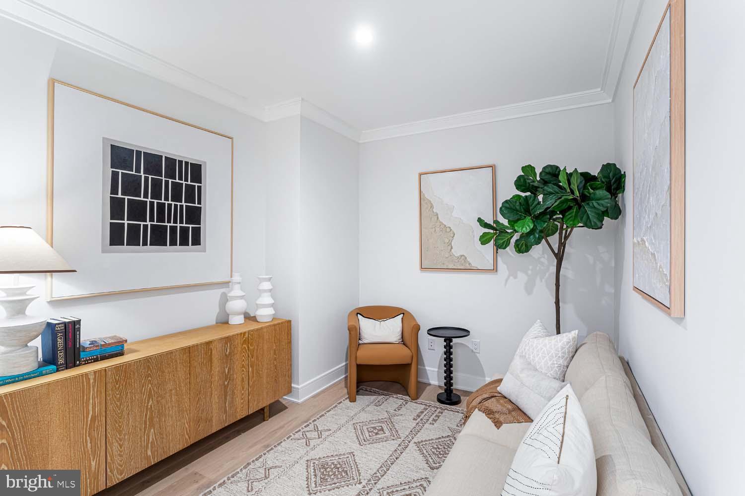 6718 Lowell Avenue, Unit 406 McLean, VA 22101 - Photo 6 of 86 a living room with furniture flowerpot and wooden floor