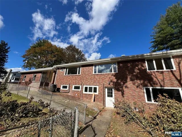 aerial view of a house with a big yard