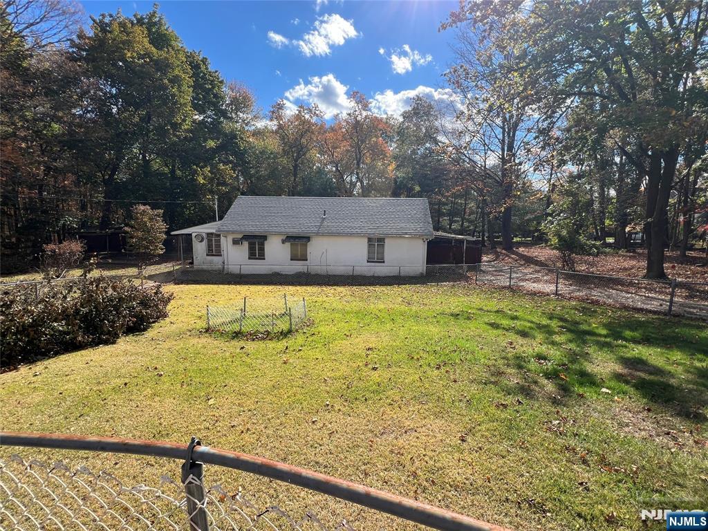 391 Forest Road Mahwah, NJ 07430 - Photo 31 of 32 a view of a swimming pool with a patio and a yard
