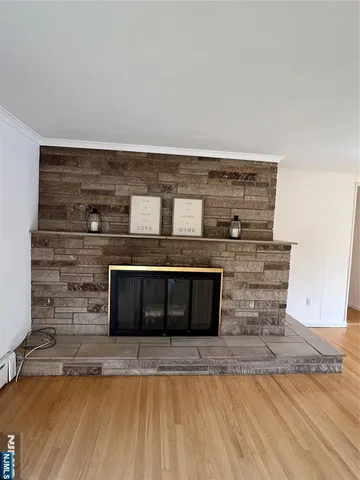 a view of a fireplace with wooden floor