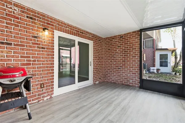 a view of a brick house with a large windows