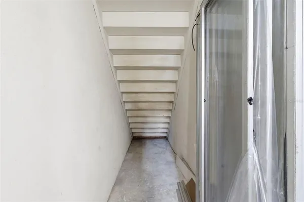 a utility room with cabinets washer and dryer