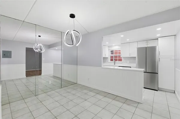 a open kitchen with cabinets and stainless steel appliances