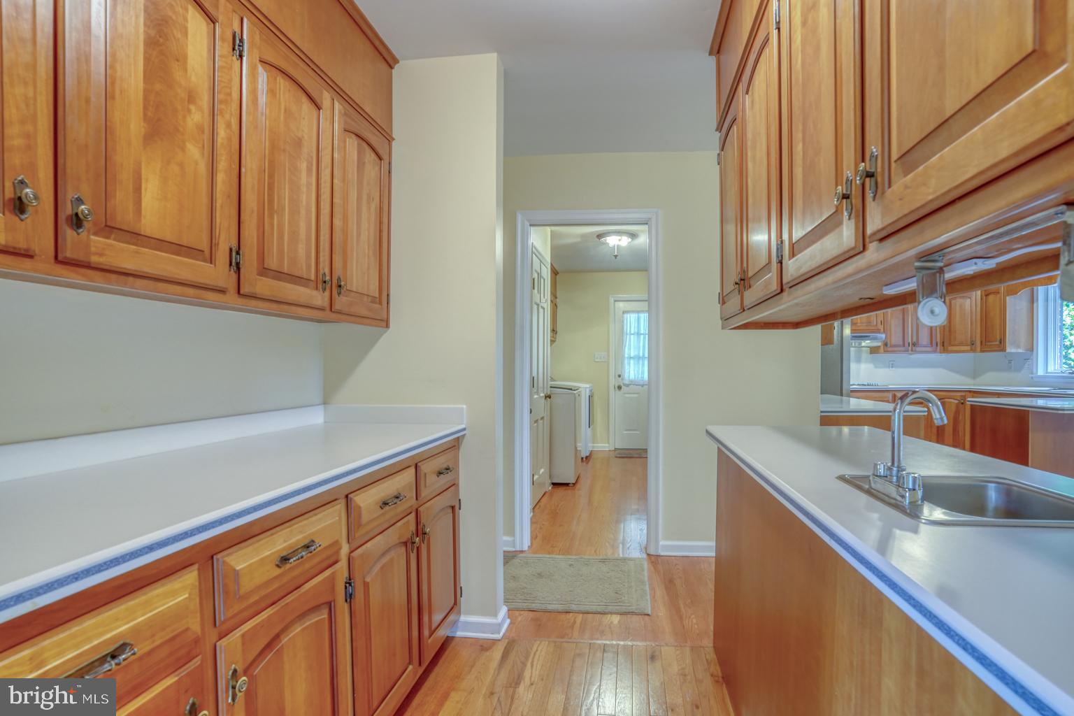 5 Stuart Drive Dover, DE 19901 - Photo 17 of 64 a kitchen with stainless steel appliances granite countertop a sink and dishwasher a stove with wooden floor