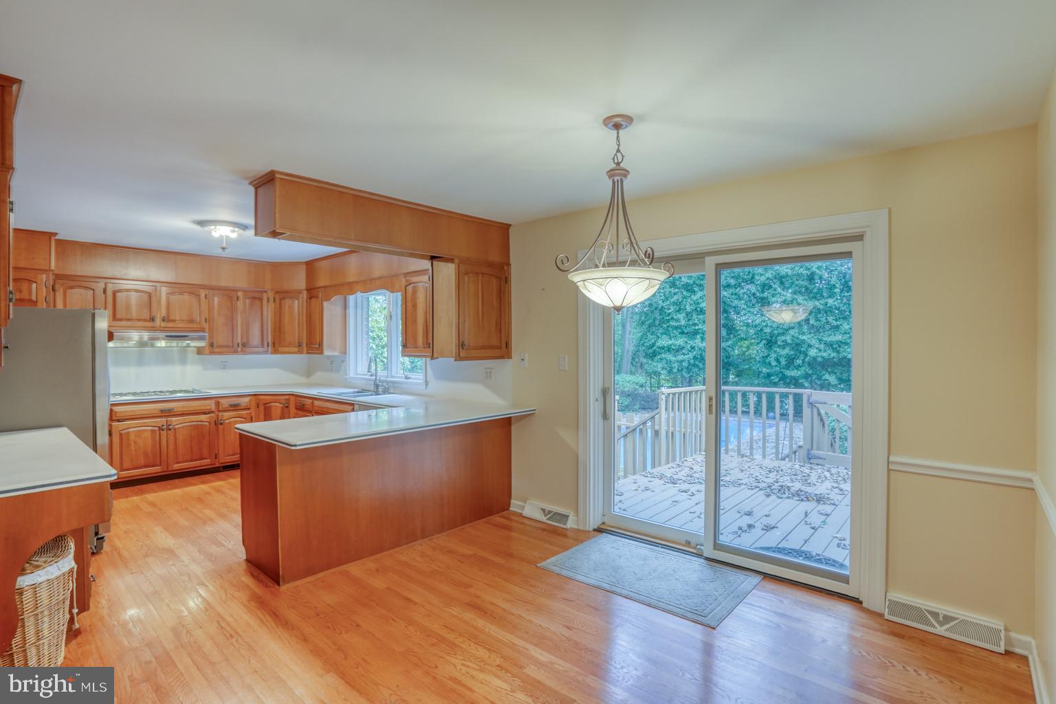 5 Stuart Drive Dover, DE 19901 - Photo 18 of 64 a view of kitchen with granite countertop cabinets and wooden floor