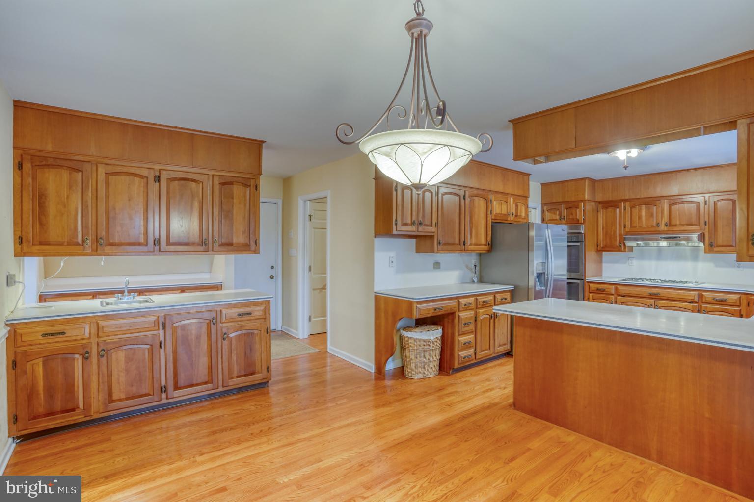 5 Stuart Drive Dover, DE 19901 - Photo 21 of 64 a view of a kitchen counter top space and wooden floor
