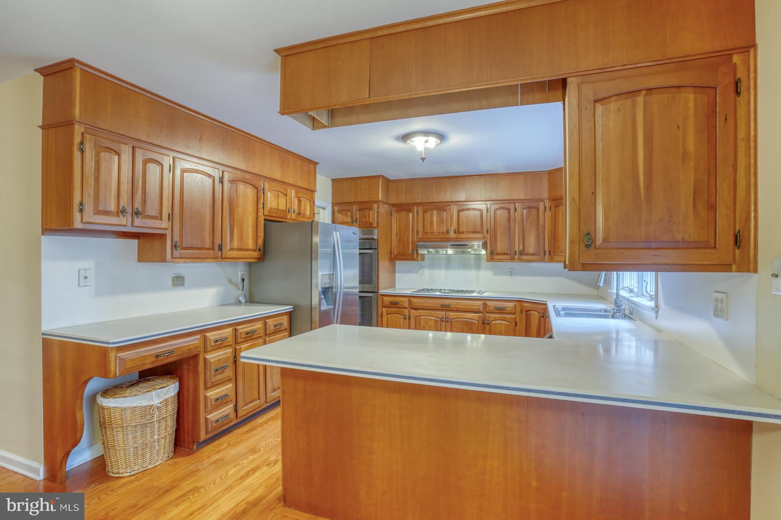 5 Stuart Drive Dover, DE 19901 - Photo 22 of 64 a kitchen with stainless steel appliances granite countertop a sink a stove cabinets counter space and a sink
