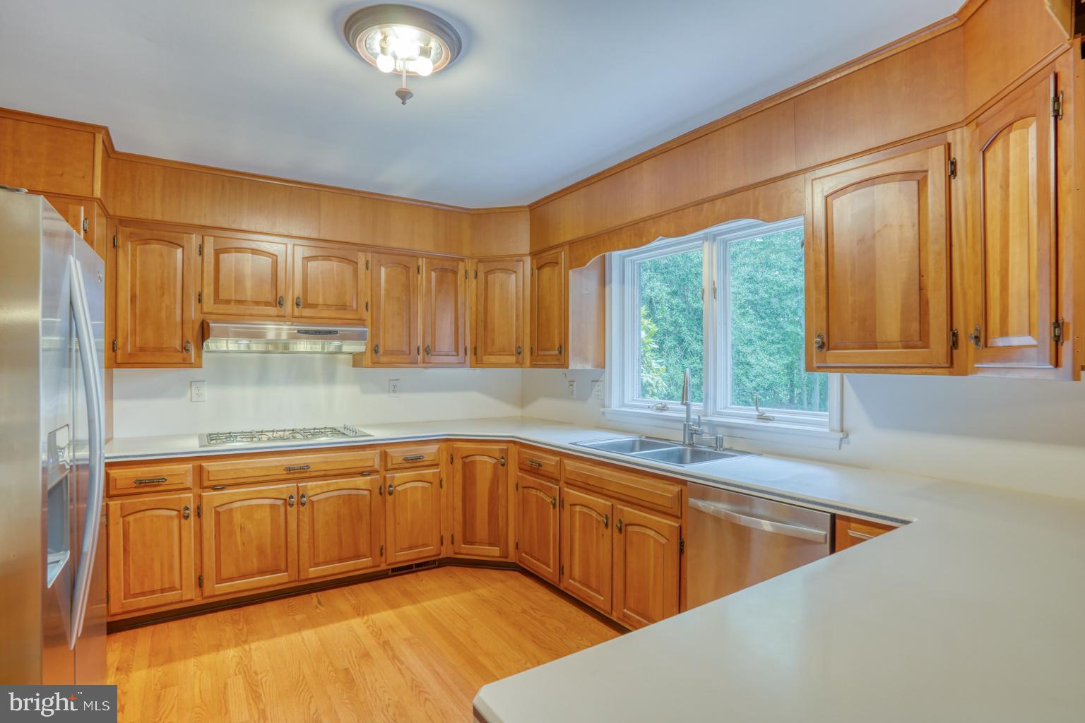 5 Stuart Drive Dover, DE 19901 - Photo 25 of 64 a kitchen with stainless steel appliances granite countertop a sink a stove and a refrigerator