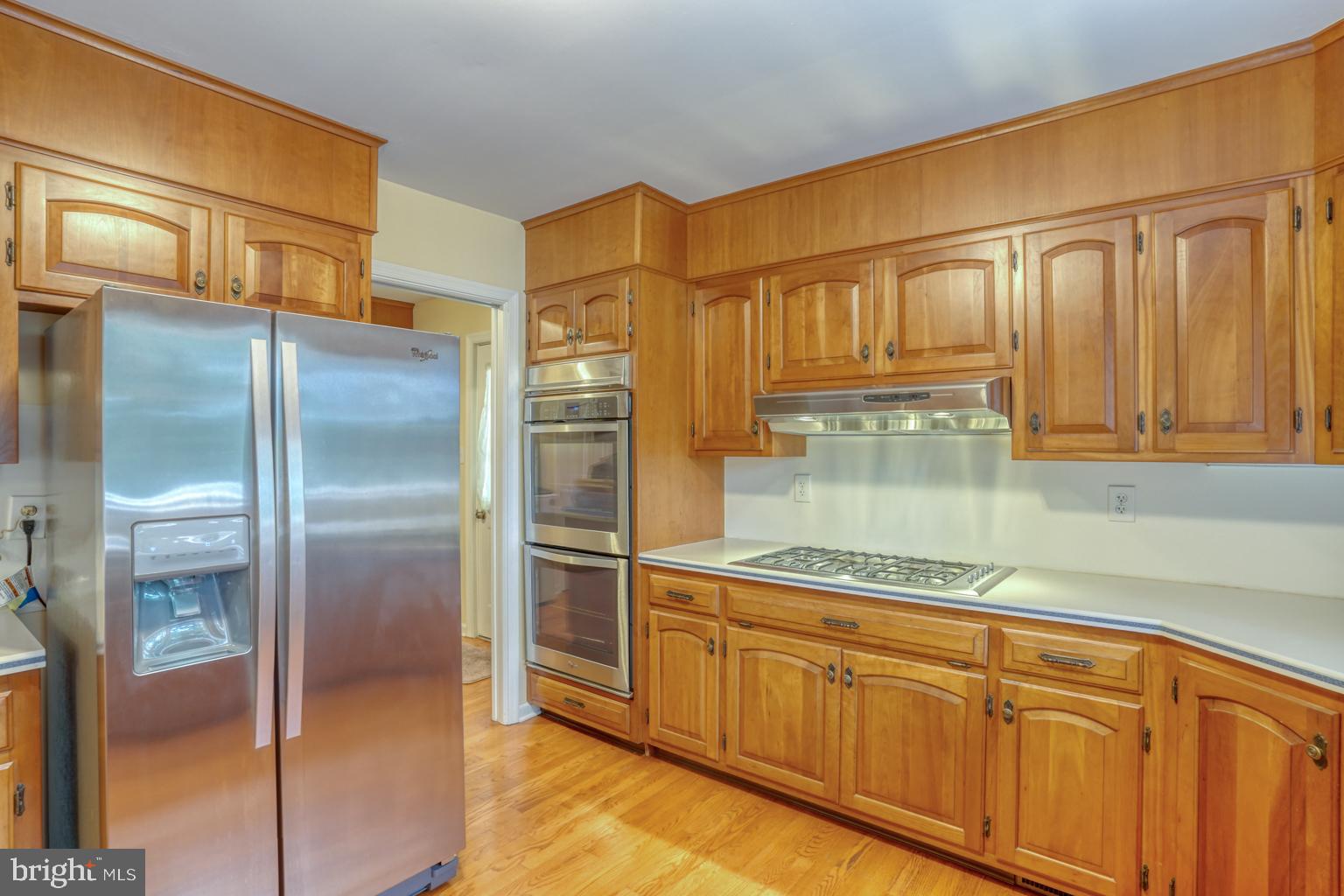 5 Stuart Drive Dover, DE 19901 - Photo 26 of 64 a kitchen with stainless steel appliances granite countertop a refrigerator and a sink