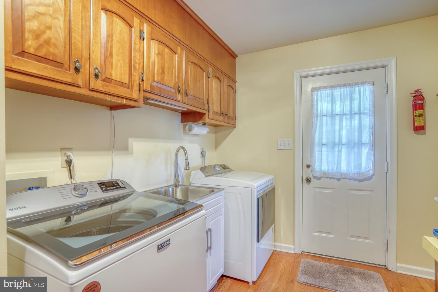 5 Stuart Drive Dover, DE 19901 - Photo 32 of 64 a kitchen with stainless steel appliances granite countertop a sink and cabinets