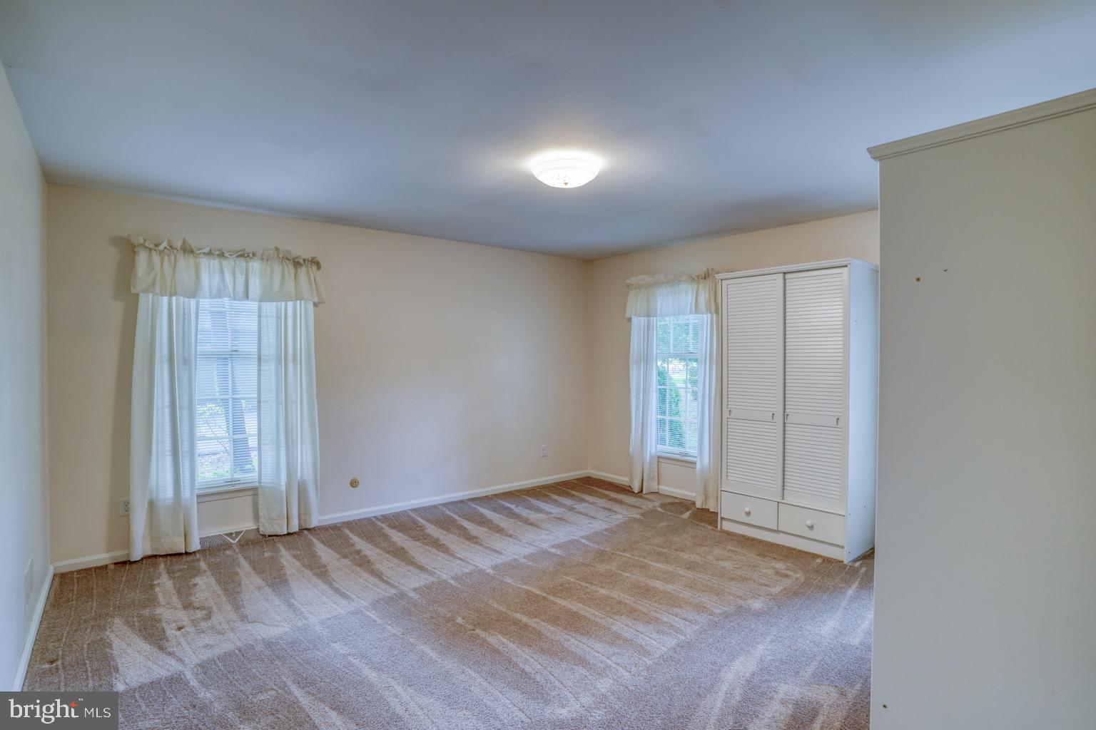 5 Stuart Drive Dover, DE 19901 - Photo 37 of 64 an empty room with closet and windows