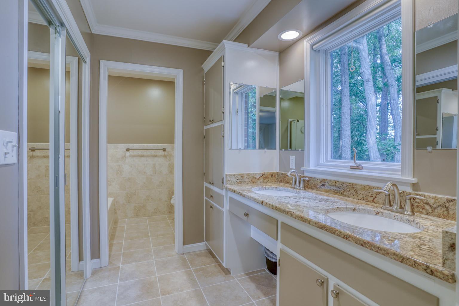 5 Stuart Drive Dover, DE 19901 - Photo 42 of 64 a bathroom with a granite countertop sink and a mirror