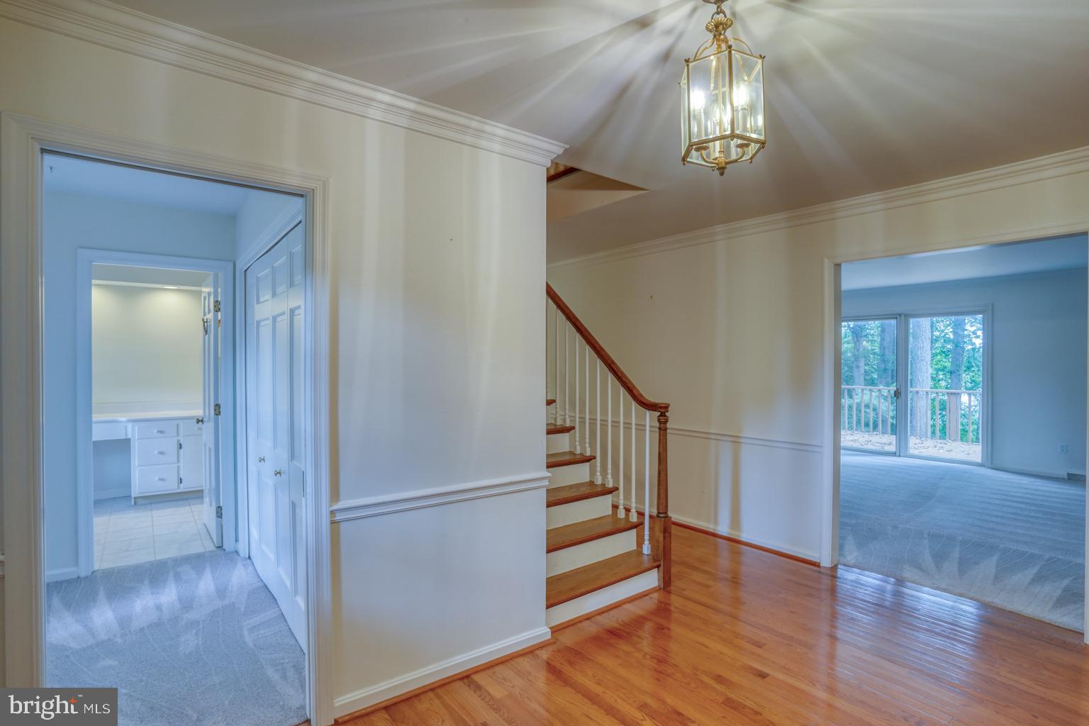 5 Stuart Drive Dover, DE 19901 - Photo 10 of 64 a view of an entryway with wooden floor and staircase