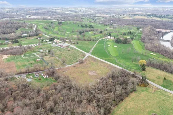 a view of a field with an outdoor space