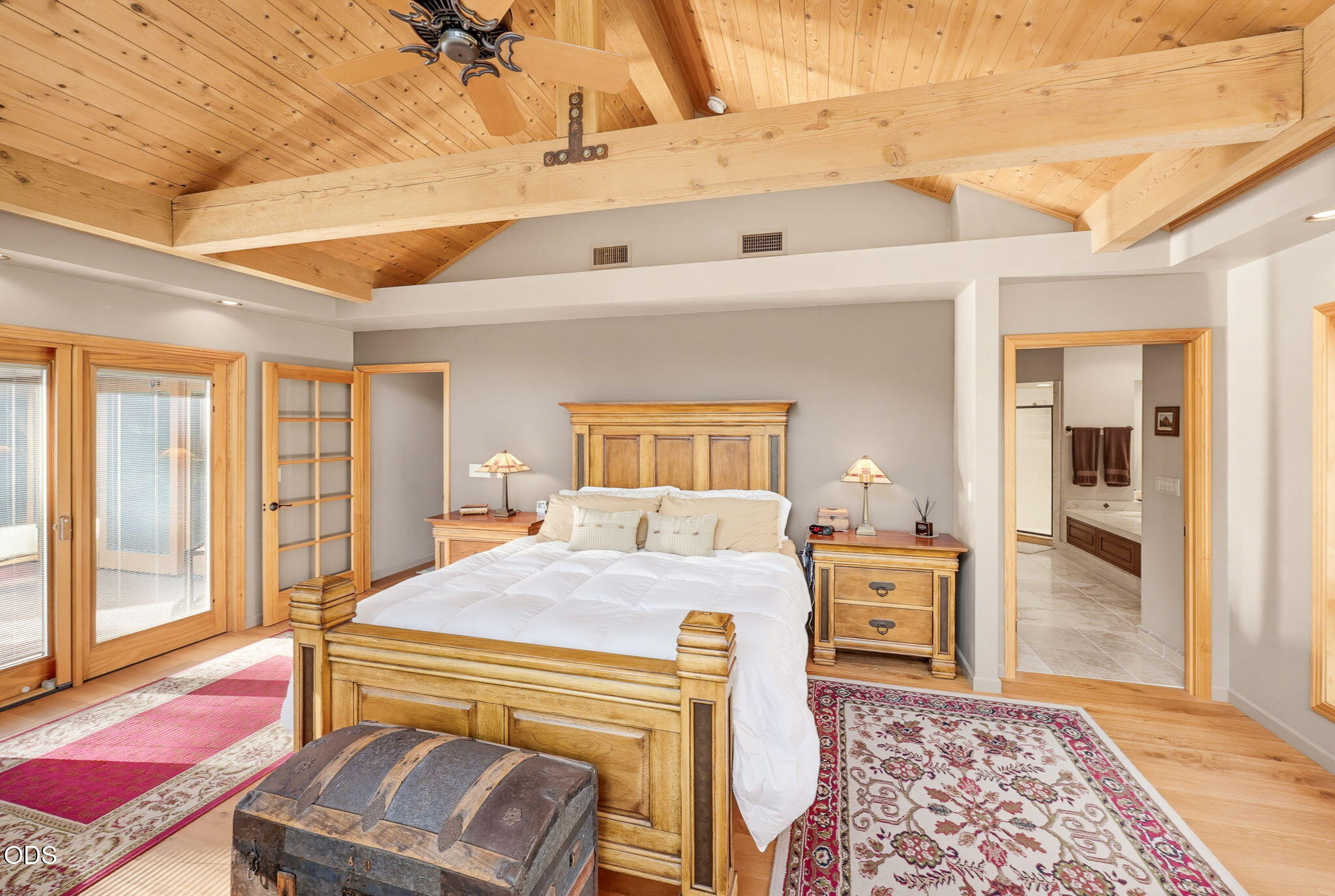 2459 Little Applegate Road Jacksonville, OR 97530 - Photo 28 of 86 a bedroom with a bed and wooden floor