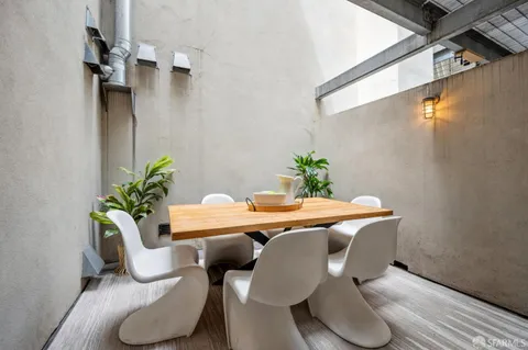 a workspace with furniture and a potted plant