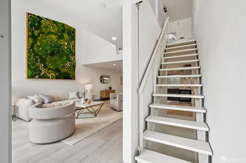 a bedroom with bed and a chandelier