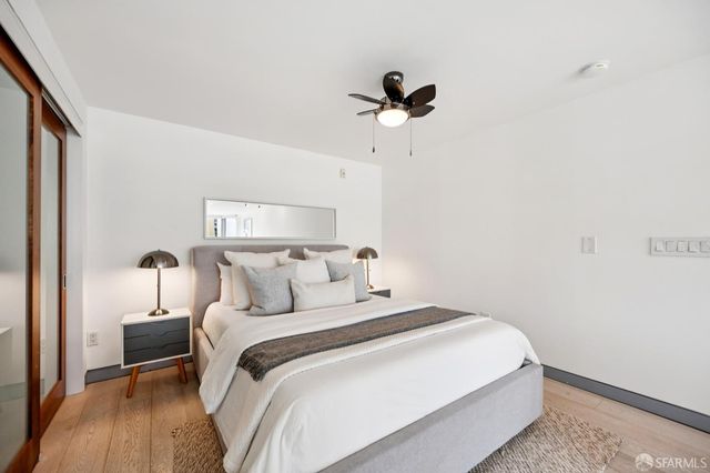 a bed room with a bed and a chandelier