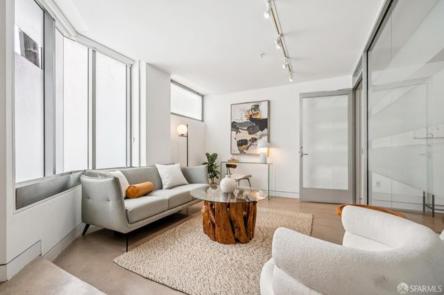 a living room with furniture and a table