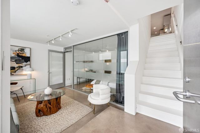 a living room with furniture and a table