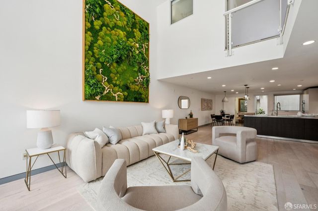 a living room with furniture and a lamp