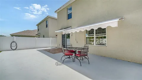 a view of workspace with furniture and window