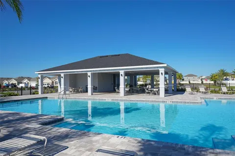 a view of a house with a yard porch and sitting area