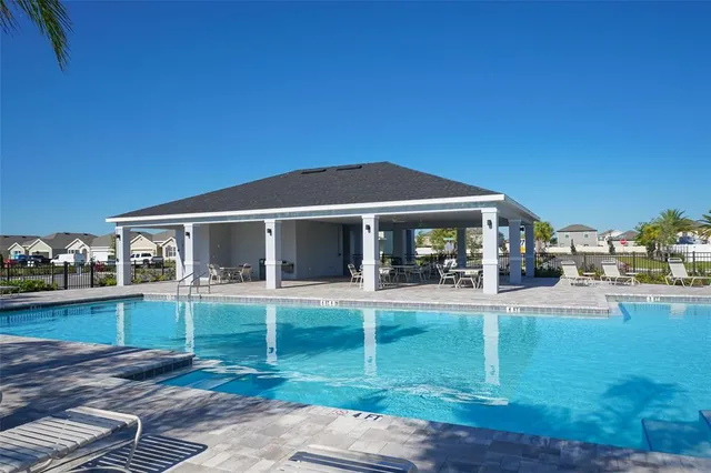 a view of a house with a yard porch and sitting area