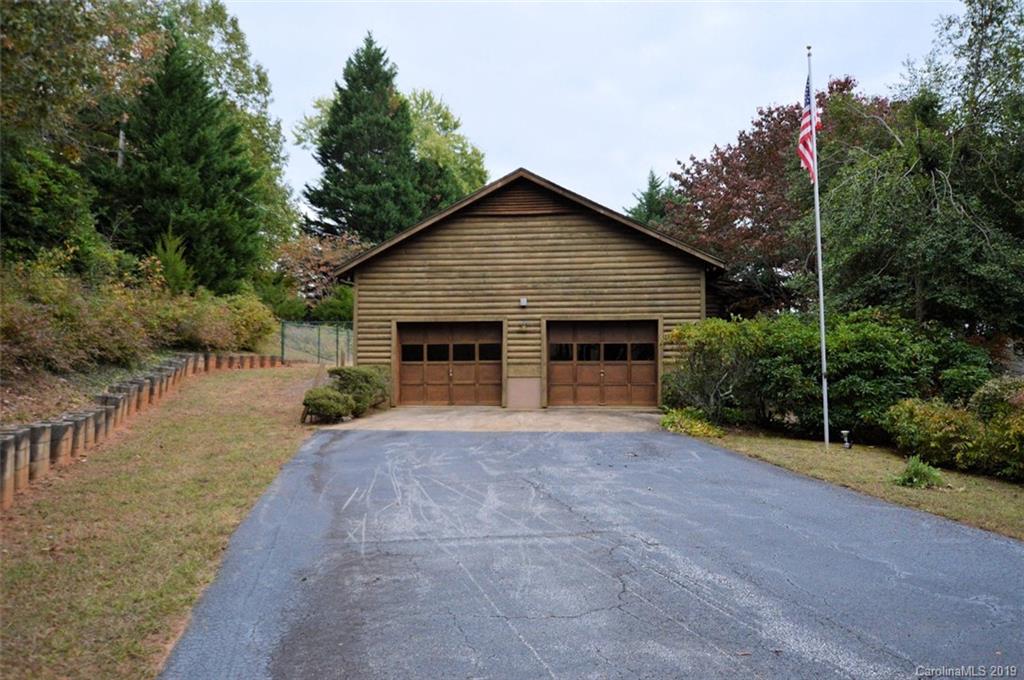 1485 Red Fox Road Tryon, NC 28782 - Photo 14 of 17 a view of house with yard and trees in the background
