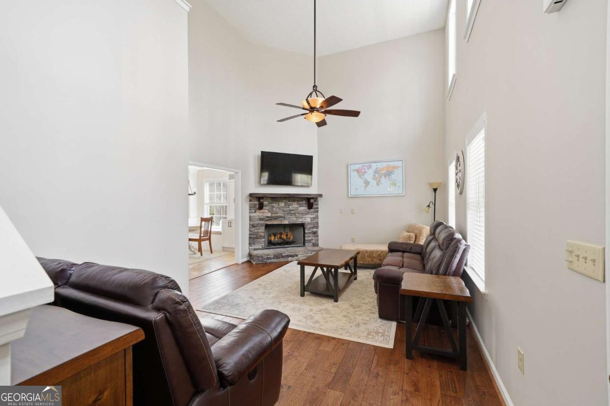 134 Nicholson Lane Talking Rock, GA 30175 - Photo 18 of 72 a living room with furniture a fireplace and a flat screen tv