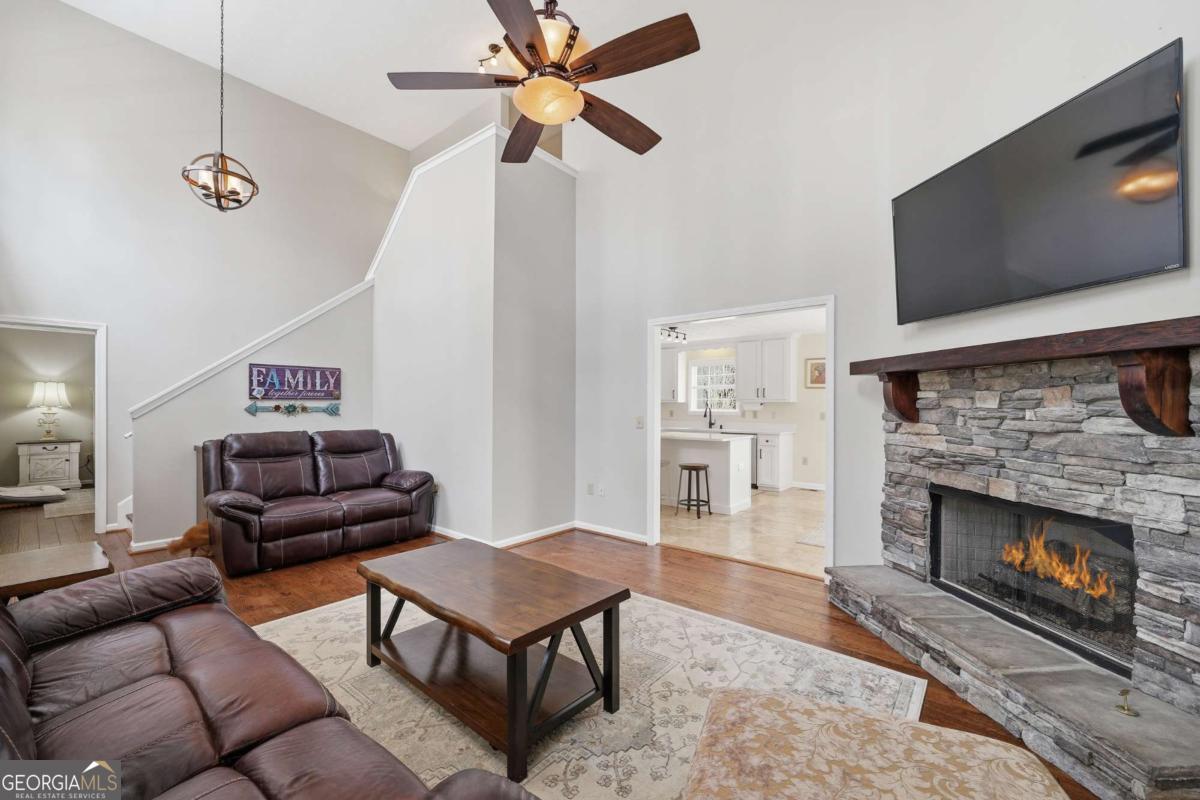 134 Nicholson Lane Talking Rock, GA 30175 - Photo 20 of 72 a living room with furniture a flat screen tv and a fireplace