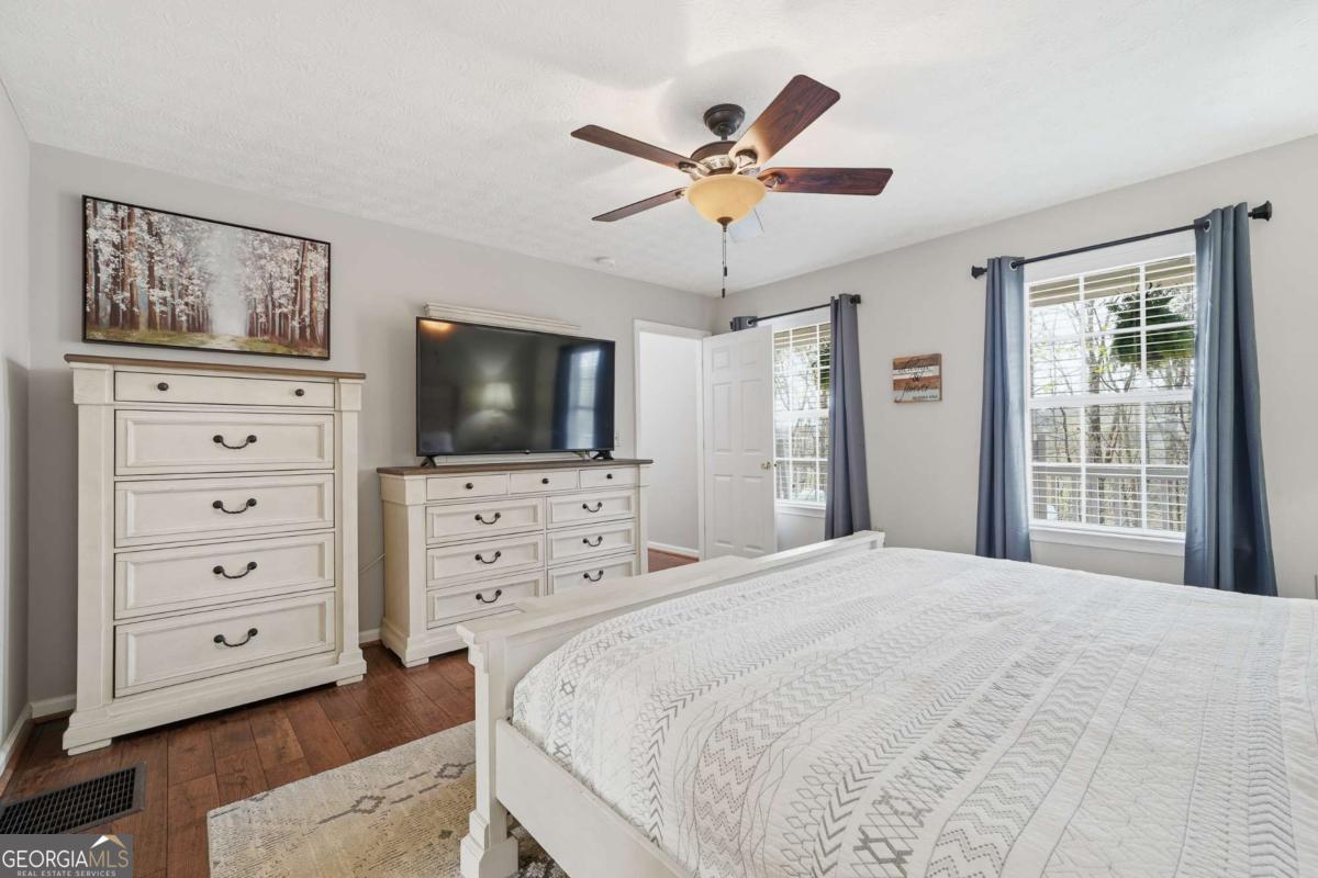 134 Nicholson Lane Talking Rock, GA 30175 - Photo 26 of 72 a bedroom with a bed and a flat screen tv